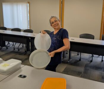LOSS Team member showing an empty container